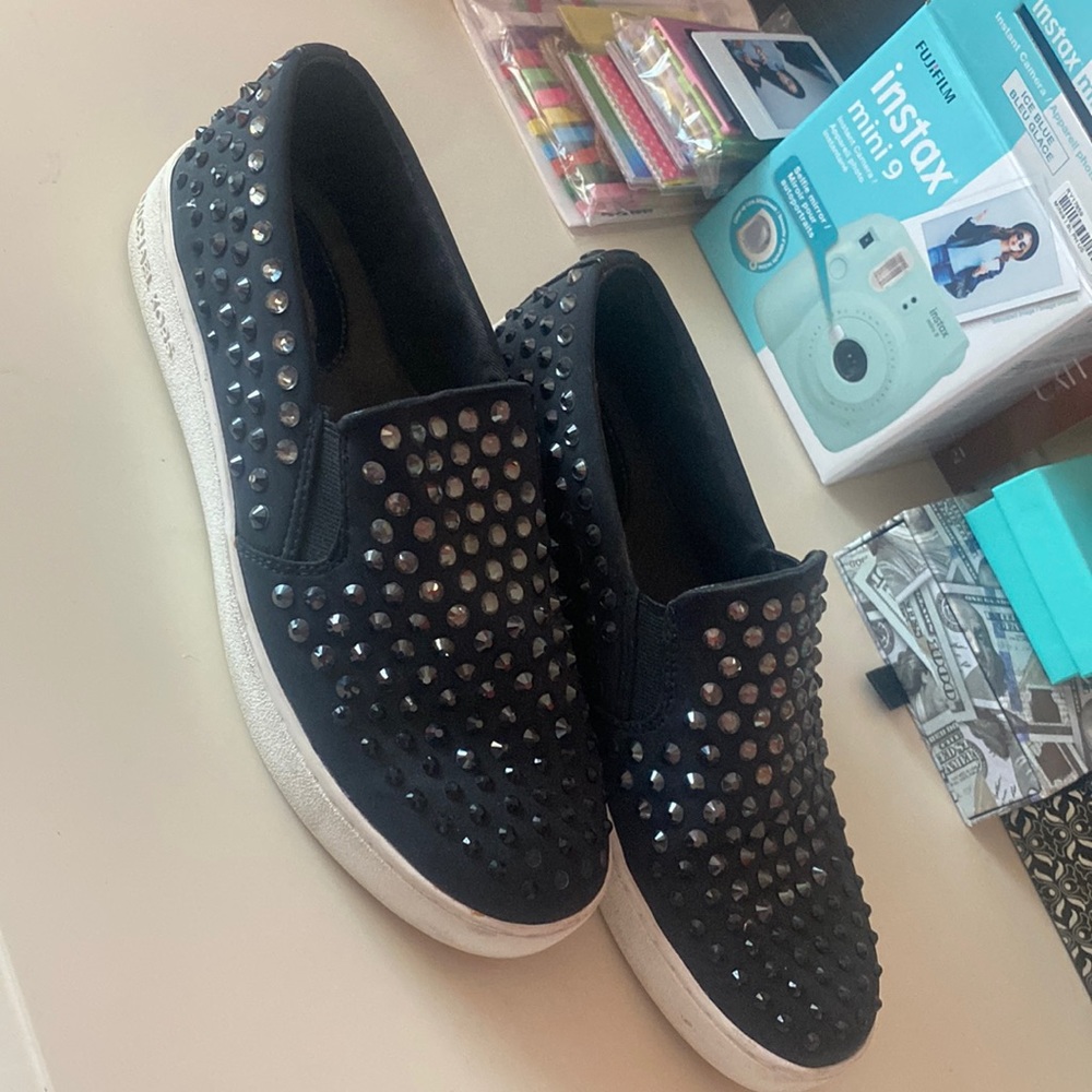 Black Michael Kors flat shoes.